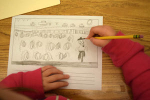 Child drawing calendar page