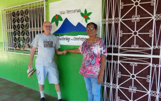 Kim and MariaElana by painting of Sister Islands logo